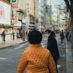 Vintage bicycles roll through bustling city streets